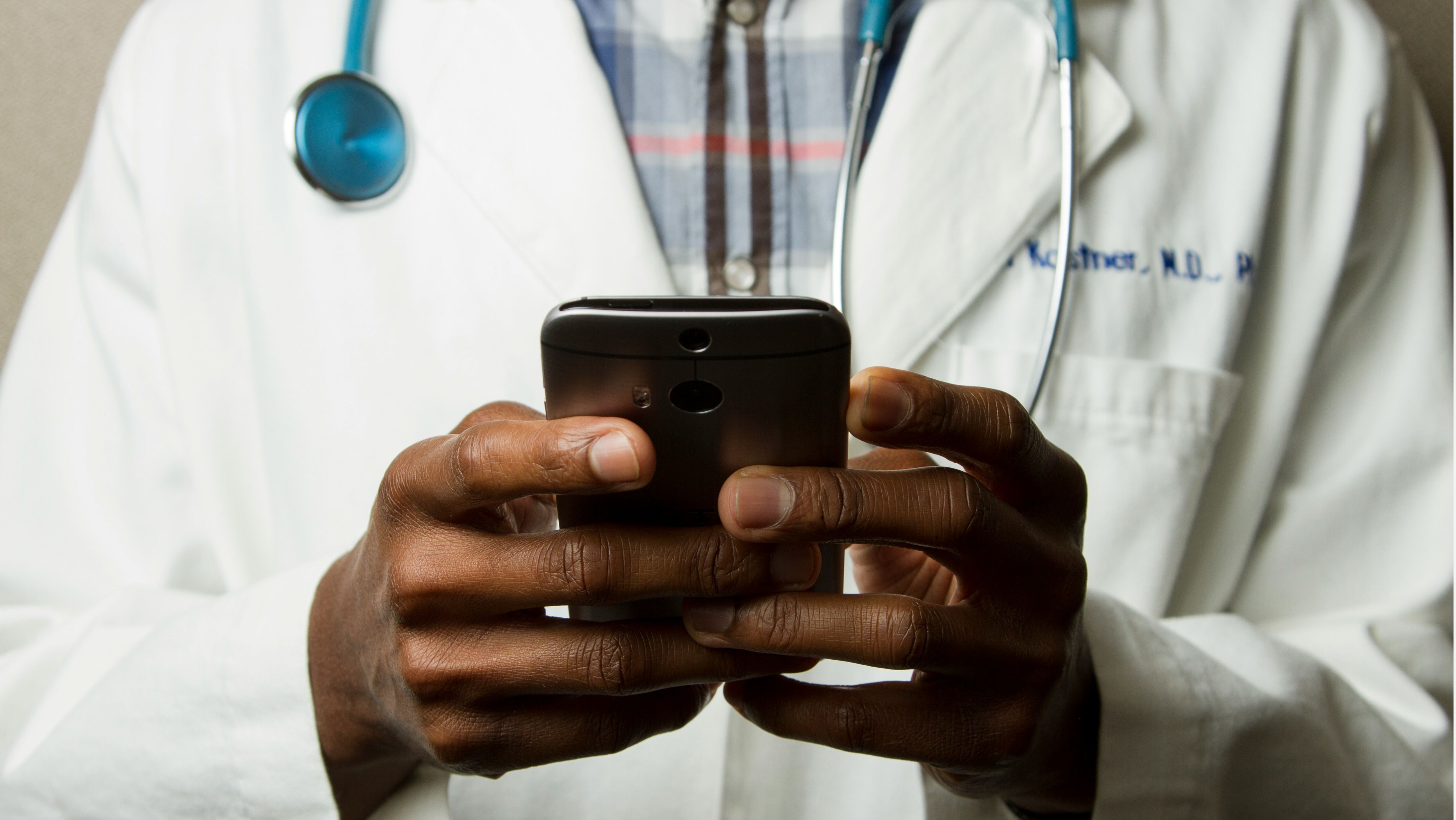 Healthcare professional using mobile app.